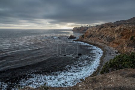Gorgeous coastline view of Point Vicente and Pelican Cove at sunset with colorful clouds in the sky, Terranea Trail, Rancho Palos Verdes, California