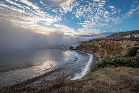 Experience the beauty of Rancho Palos Verdes as a marine layer blankets the coast, creating a mesmerizing cloudscape over rugged cliffs and hidden gems like Point Vicente Lighthouse and Pelican Cove.