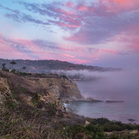 Experience the beauty of Rancho Palos Verdes as a marine layer blankets the coast, creating a mesmerizing cloudscape over rugged cliffs.