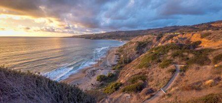 Discover the serene beauty of Rancho Palos Verdes along the Catalina Trail and Sunset Trail, where rugged cliffs meet the calming ocean waves under Southern California's golden and blue hour skies.