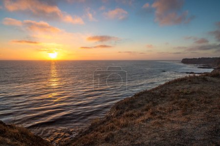 Gorgeous blufftop view of Golden Cove at sunset with colorful clouds in the sky, Rancho Palos Verdes, California