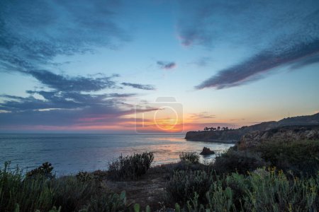 Breathtaking coastline view of Point Vicente and Pelican Cove at sunset with colorful clouds in the sky, Terranea Trail, Rancho Palos Verdes, California