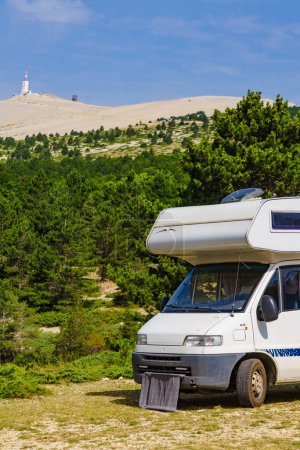 Caravan camping in mountains. Summit of Mont Ventoux in the distance. Travel attraction in Provence region, southern France.