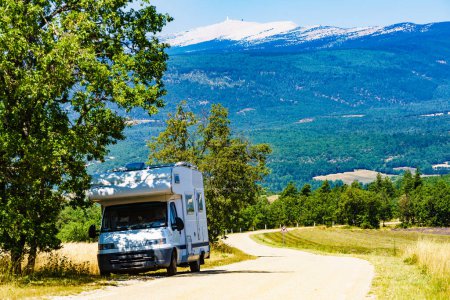 Caravan on holidays in southern France. Summit of Mont Ventoux in the distance. Travel attraction in Provence region.