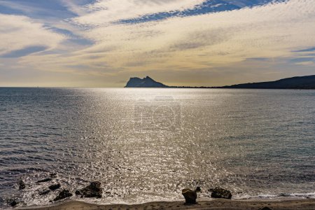 Gibraltar rock, british overseas territory on spanish coast. View from Torrecarbonera beach, Punta Mala, Andalusia Spain. Tourist attraction.