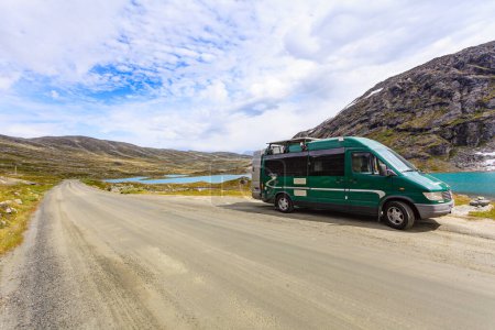 Camper car in norwegian mountains. Travel, holidays and adventure concept.
