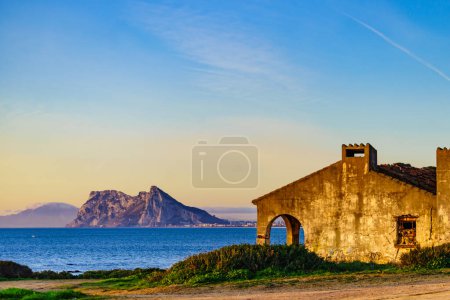 Seascape with Gibraltar rock on horizon. View from Torrecarbonera beach, Punta Mala, Andalusia Spain.