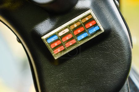 Close up of car fuse box in auto truck tractor machine vehicle. Electronics in transportation.