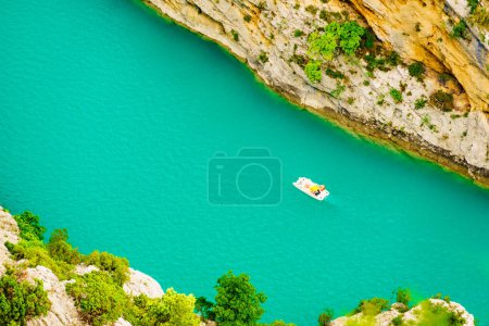 Boats on turquoise water of St Croix Lake, Verdon Gorge in french Alps mountains, Provence France. Holidays trip.