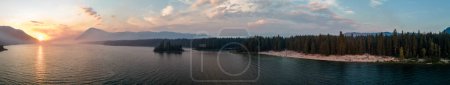 Photo for Smoke Filled Sky From Forest Fires at Lake Wenatchee WA USA Create Brilliant Orange Colored Sunset Aerial Panoramic - Royalty Free Image