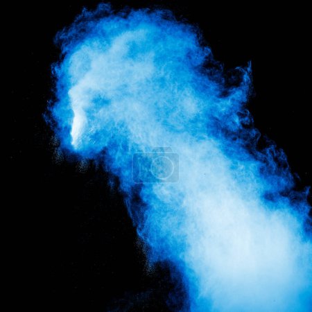 Photo for Blue dust explosion on black background. Freeze motion of color powder splash. - Royalty Free Image