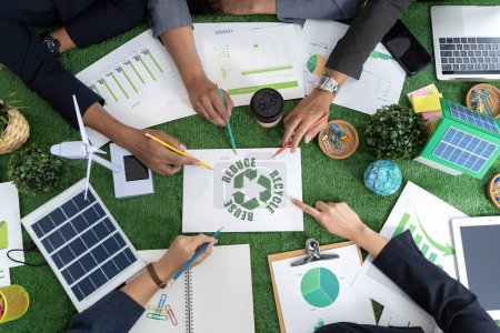 Group of businessmen's hands touching green recycling symbol, showing a mockup of green earth with recycling icons. Embracing a commitment to sustainable living and global responsibility.