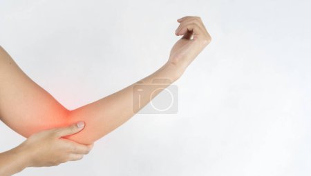 Photo for Close up woman's hand holding her elbow . Elbow pain concept. Woman with elbow pain. - Royalty Free Image