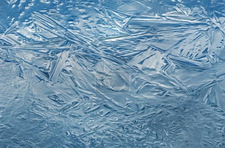 Photo for Winter closeup of an abstract, blue ice pattern, Lake Doster, Michigan, USA - Royalty Free Image