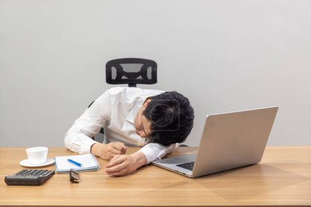 Man with narcolepsy is fall asleep on office desk