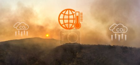 Photo for Wildfires release carbon dioxide (CO2) emissions and other greenhouse gases (GHG) that contribute to climate change and global warming. aerial view. - Royalty Free Image