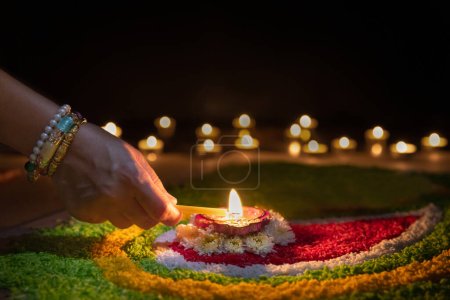 Photo for Clay diya lamps lit during diwali celebration, Diwali, or Dipawali, is India's biggest and most important holiday. - Royalty Free Image