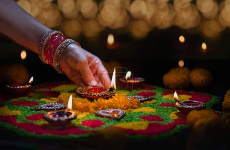 Photo for Clay diya lamps lit during diwali celebration, Diwali, or Deepavali, is India's biggest and most important holiday. - Royalty Free Image