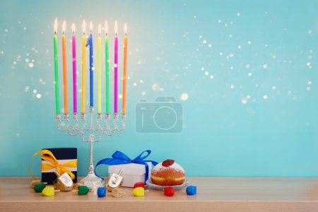 Foto de Image of jewish holiday Hanukkah with menorah (traditional candelabra) and colorful candles - Imagen libre de derechos