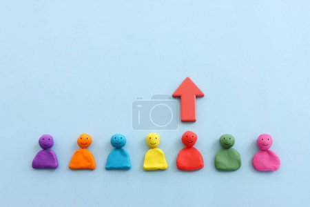 Photo for Red arrow and people figures. Leadership and growth concept - Royalty Free Image