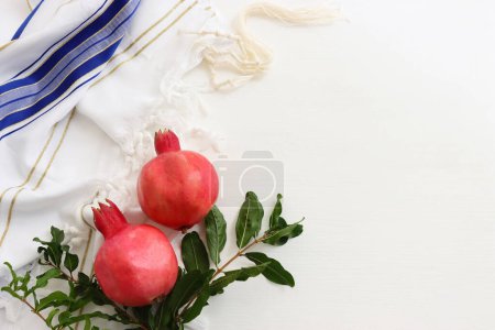 Photo for Religion image of pomegranate on white prayer talit. Rosh hashanah (jewish New Year holiday), Shabbat and Yom kippur concept - Royalty Free Image