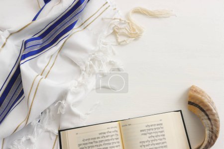Photo for Religion image of shofar (horn) on white prayer talit. Rosh hashanah (jewish New Year holiday), Shabbat and Yom kippur concept - Royalty Free Image