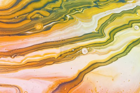 art photography of abstract marbleized effect background with yellow, gold and white creative colors. Beautiful paint.