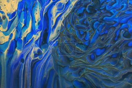 fotografía de arte de fondo efecto marmolizado abstracto con colores creativos azules y dorados. Hermosa pintura.