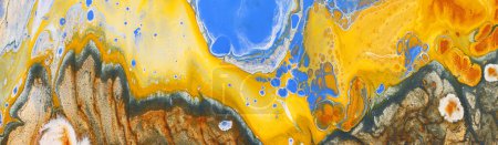 fotografía artística de fondo de efecto marmolizado abstracto con colores creativos amarillos, azules, dorados y cobre. Hermosa pintura.