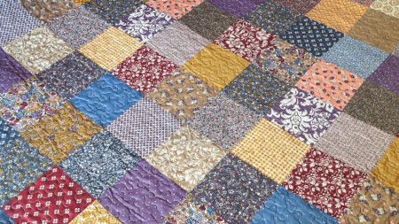 Photo for Print in patchwork style. Quilted quilt with patchwork print. Geometrical pattern. Selective soft focus - Royalty Free Image