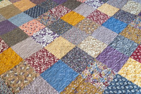 Print in patchwork style. Patchwork print quilt. Geometrical pattern. Selective focus