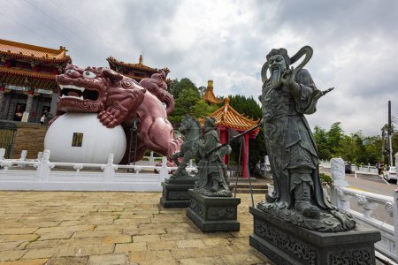 Photo for Sun Moon Lake, Taiwan - May 24, 2023: In the tranquil ambiance of Sun Moon Lake Wen Wu Temple, majestic Buddhist statues grace the surroundings, emanating sense of serenity, enlightenment and harmony - Royalty Free Image
