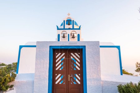 Photo for Classical white and blue greek church on the top of a hill in Santorini, Greece. - Royalty Free Image
