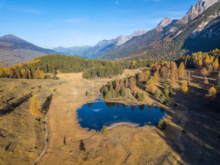 Photo for Aerial drone image of the mountain lake Lai Nair on the hiking area of Tarasp, Canton Grisons, Switzerland - Royalty Free Image