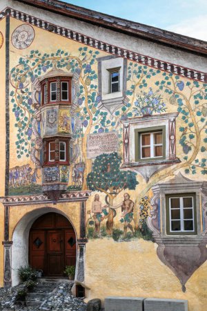 Ardez, Switzerland - November 06.2022: Ardez, typical village in Engadine (Graubunden, Switzerland): Chasa Claguna, historic house with frescos representing Adam and Eve