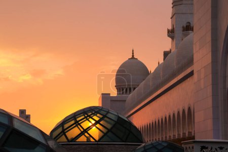 Photo for The sunset through the glass dome at the Sheikh Zayad Grand Mosque in Abu Dhabi. - Royalty Free Image