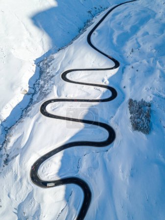 Photo for Aerial view of the winding road over the  Julier Pass in Swiss Alps mountain in winter full of snow, Canton Grison, Switzerland - Royalty Free Image