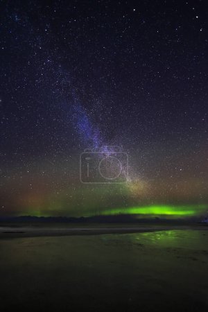 Milky way and Aurora borealis occur at the same time in the northern sky, Lofoten