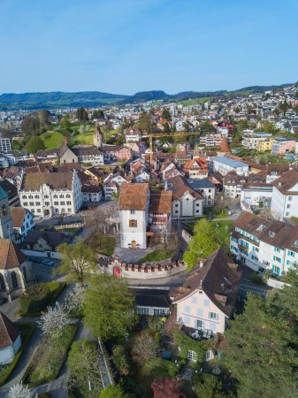 Aerial drone image of the old Swiss town Zug with Museum in Burg in the center