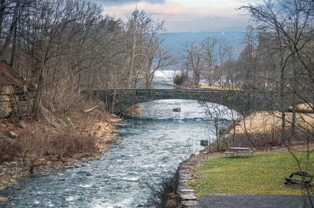 A stone bridge crossing Lake Cayuga in the Finger Lakes region of New York.