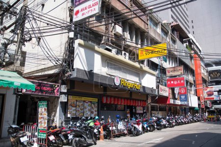 Foto de Bangkok, Thailand- 15 Feb, 2023: Various billboards display on the shop along Silom area, Bangkok. Silom area nightlife is most famous for its red light district of Patpong - Imagen libre de derechos