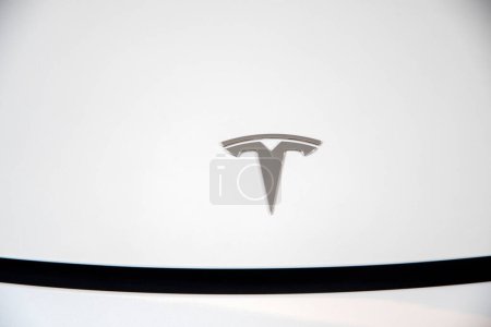 Photo for Bangkok, Thailand- 15 Feb, 2023: Tesla logo on  EV electric vehicles on display. Tesla products include electric cars, battery energy storage and solar panels. - Royalty Free Image