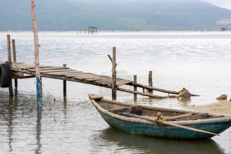 Traditional fishing boat in the oyster farming industry in Lap An Lagoon, Vietnam.