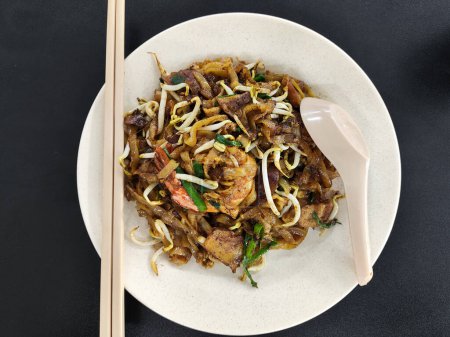 Photo for Famous Penang Char Kuey Teow with prawns. It is a famous street food in Malaysia - Royalty Free Image