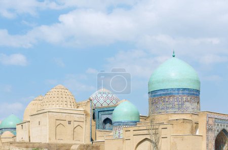 Photo for Awesome view of the Shah-i-Zinda Ensemble in Samarkand, Uzbekistan. Mausoleums decorated by blue tiles with designs. The necropolis is a popular tourist attraction of Central Asia. - Royalty Free Image