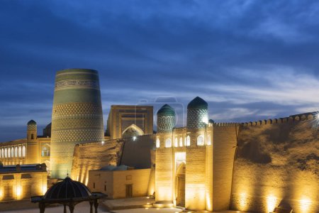 The ancient Zindan building and the entrance gate to the fortress in the city of Khiva in Khorezm. Kohna Ark gates of the palace at night, top view from above