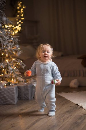 Photo for Baby boy playing with christmas toys at home - Royalty Free Image