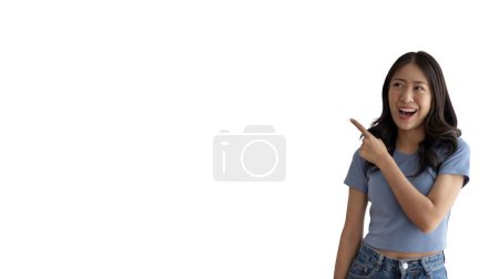Photo for Asian woman pointing finger inviting click here, It is recommended to follow this direction or click on this link, Space for promotion here, Register or apply for membership, Click here, Click below. - Royalty Free Image