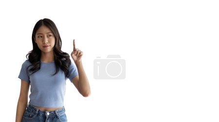 Photo for Asian woman pointing finger inviting click here, It is recommended to follow this direction or click on this link, Space for promotion here, Register or apply for membership, Click here, Click below. - Royalty Free Image