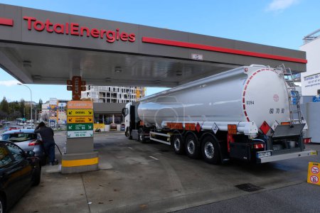 Photo for Tank truck refueling a TotalEnergies service station in the city of Vannes in Brittany - Royalty Free Image